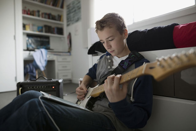Teen Boy Play Guitar